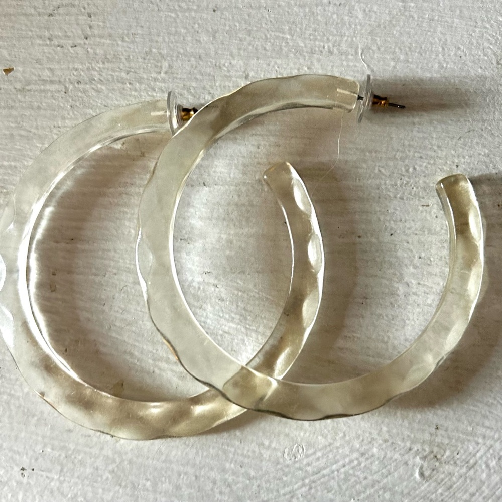 Acrylic Lucite clear hoop earrings faceted cut. Good condition.
